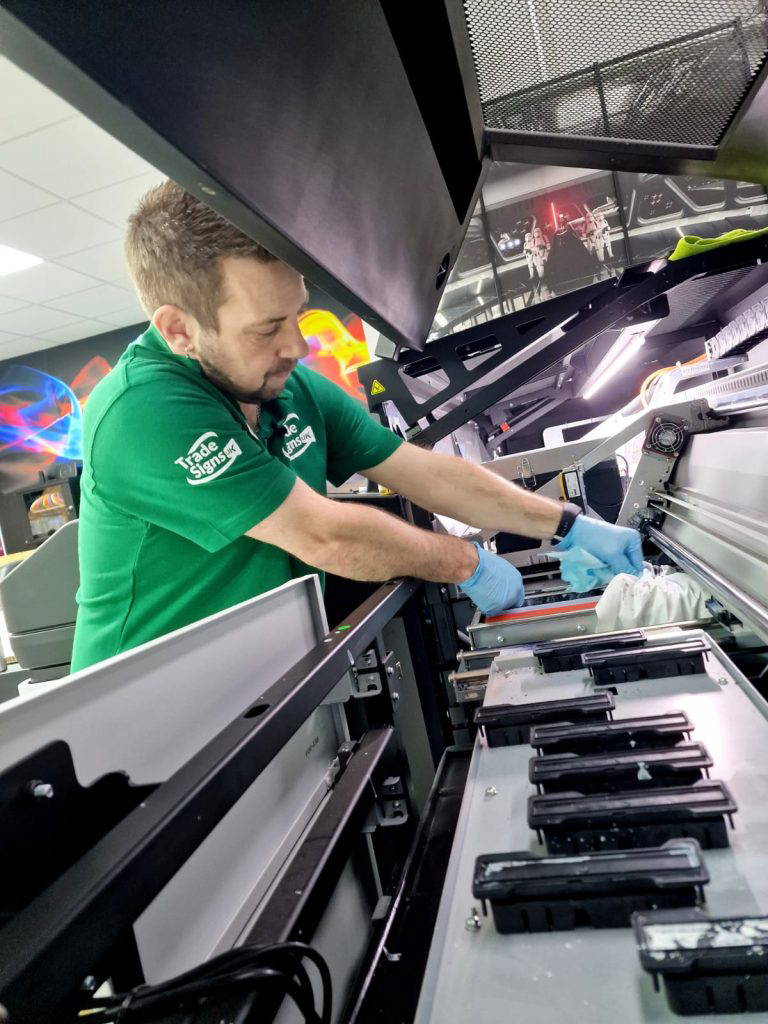 trade signs uk staff and machine maintenance